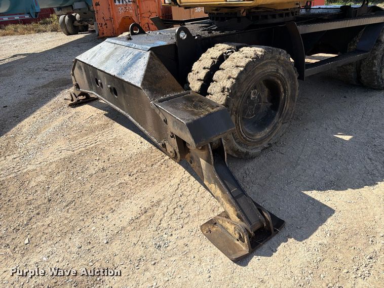 image for item FK3834 1999 Caterpillar M320 wheeled excavator