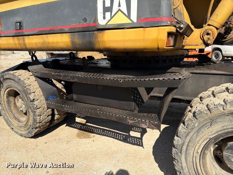 image for item FK3834 1999 Caterpillar M320 wheeled excavator