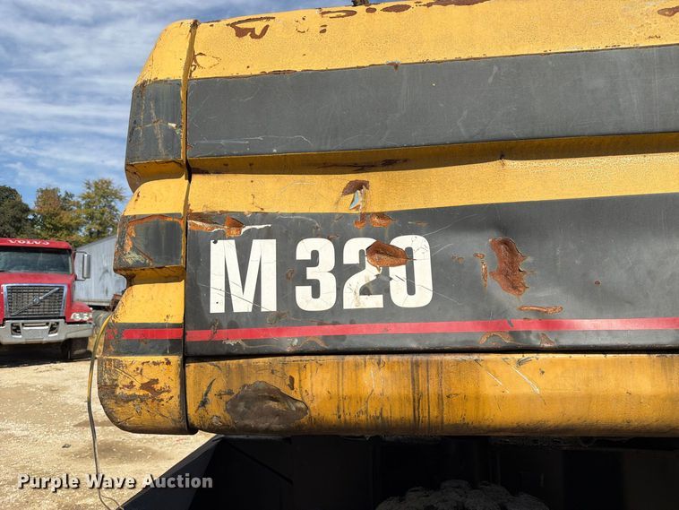image for item FK3834 1999 Caterpillar M320 wheeled excavator