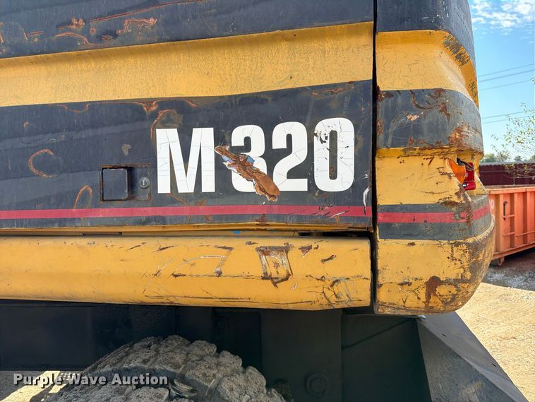 image for item FK3834 1999 Caterpillar M320 wheeled excavator