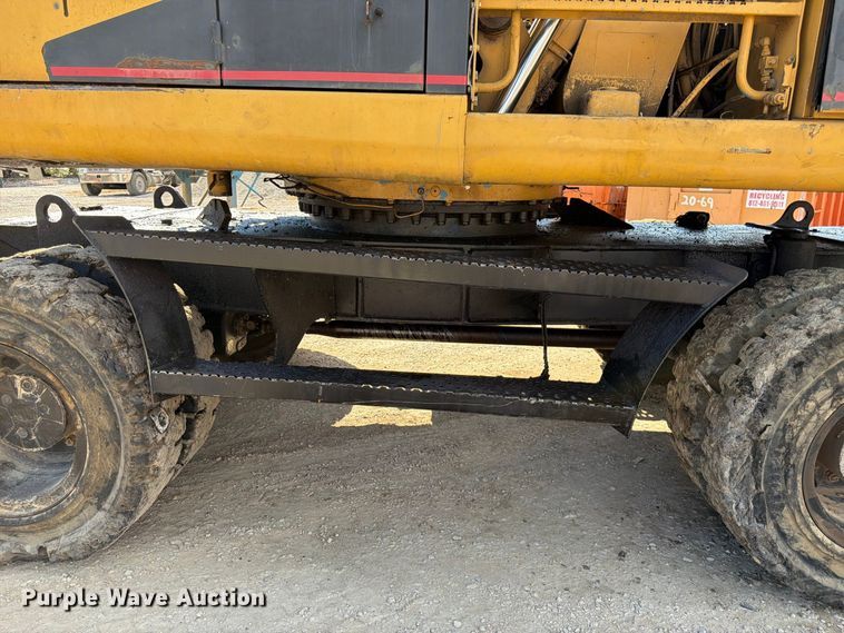 image for item FK3834 1999 Caterpillar M320 wheeled excavator