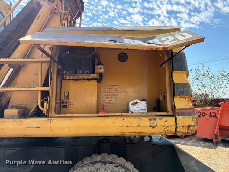 image for item FK3834 1999 Caterpillar M320 wheeled excavator