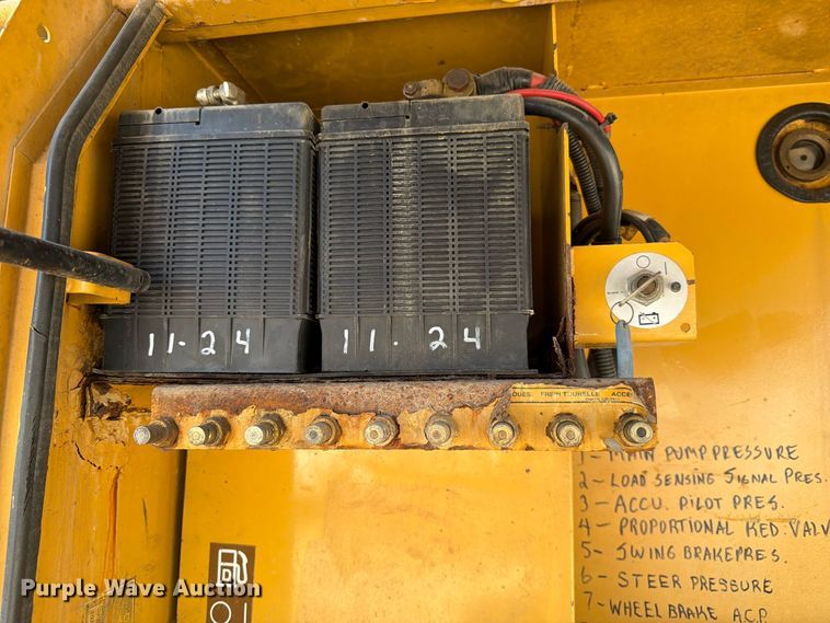 image for item FK3834 1999 Caterpillar M320 wheeled excavator