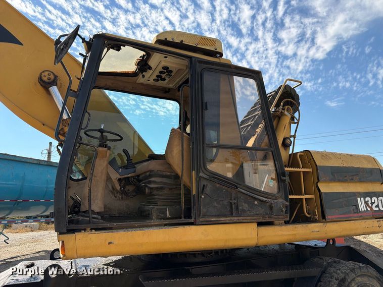 image for item FK3834 1999 Caterpillar M320 wheeled excavator