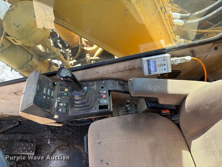 image for item FK3834 1999 Caterpillar M320 wheeled excavator