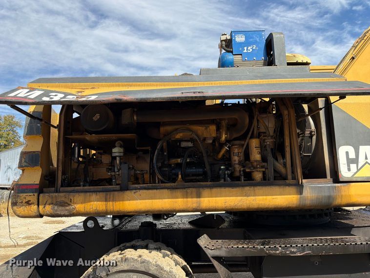 image for item FK3834 1999 Caterpillar M320 wheeled excavator