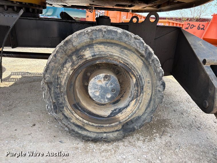 image for item FK3834 1999 Caterpillar M320 wheeled excavator