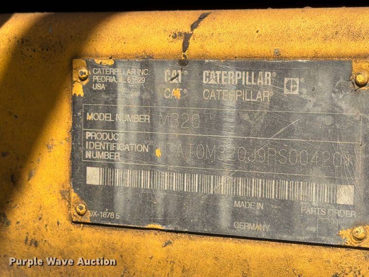image for item FK3834 1999 Caterpillar M320 wheeled excavator