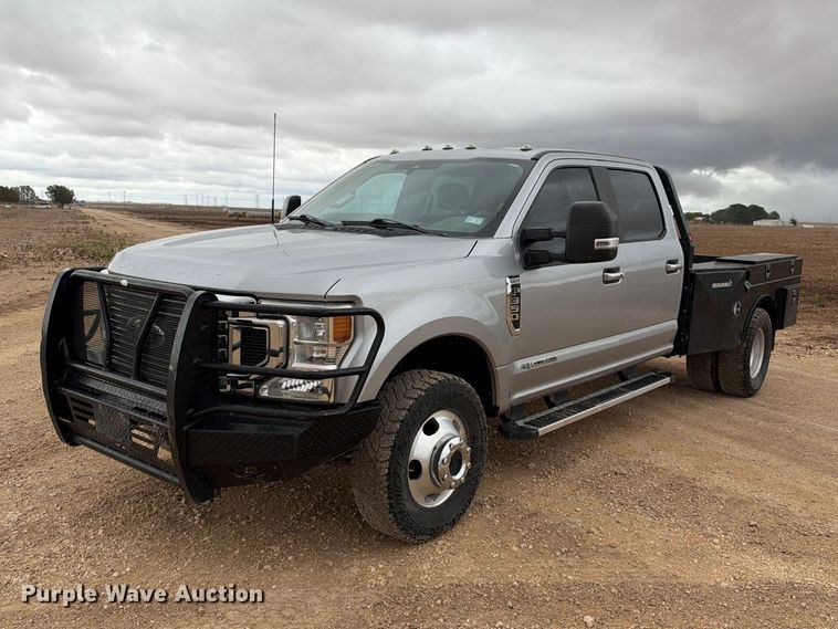 image for item FC0494 2022 Ford F350 Super Duty Crew Cab dump flatbed pickup truck