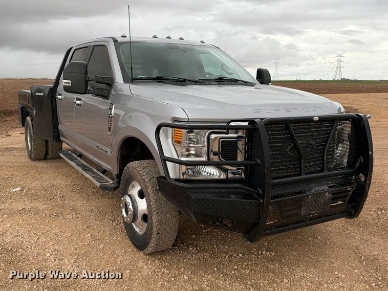 image for item FC0494 2022 Ford F350 Super Duty Crew Cab dump flatbed pickup truck