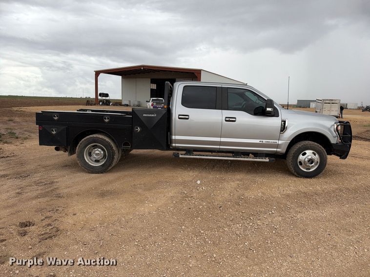 image for item FC0494 2022 Ford F350 Super Duty Crew Cab dump flatbed pickup truck
