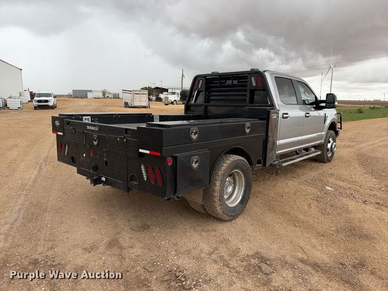 image for item FC0494 2022 Ford F350 Super Duty Crew Cab dump flatbed pickup truck