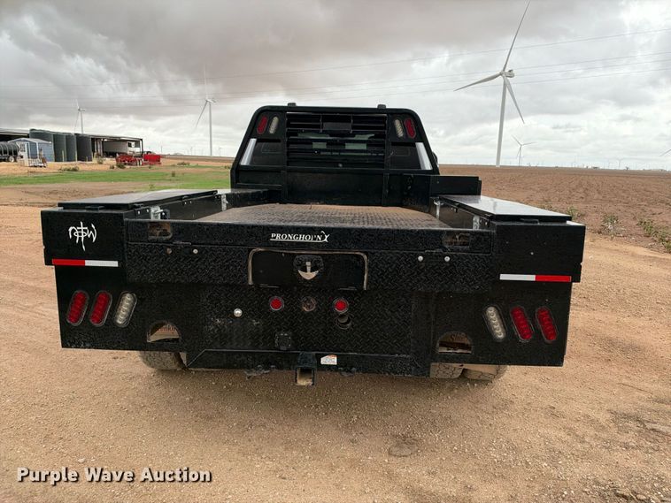 image for item FC0494 2022 Ford F350 Super Duty Crew Cab dump flatbed pickup truck