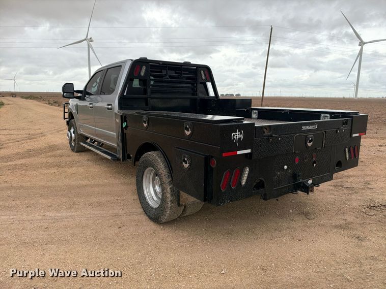 image for item FC0494 2022 Ford F350 Super Duty Crew Cab dump flatbed pickup truck