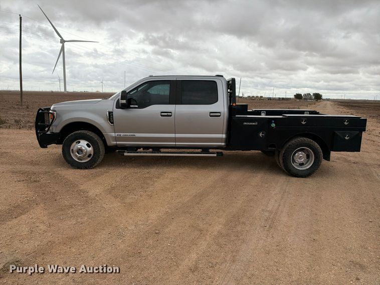 image for item FC0494 2022 Ford F350 Super Duty Crew Cab dump flatbed pickup truck