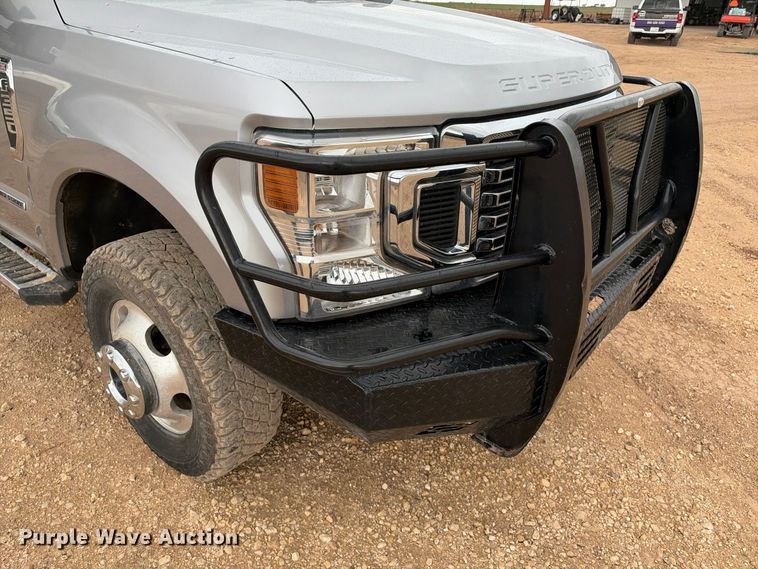 image for item FC0494 2022 Ford F350 Super Duty Crew Cab dump flatbed pickup truck