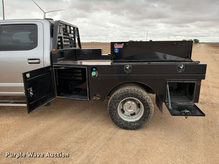 image for item FC0494 2022 Ford F350 Super Duty Crew Cab dump flatbed pickup truck