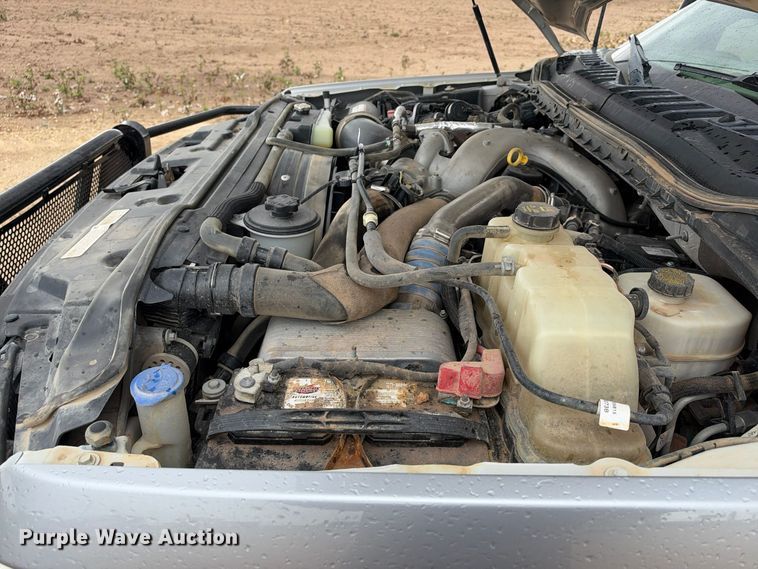 image for item FC0494 2022 Ford F350 Super Duty Crew Cab dump flatbed pickup truck