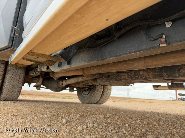 image for item FC0494 2022 Ford F350 Super Duty Crew Cab dump flatbed pickup truck