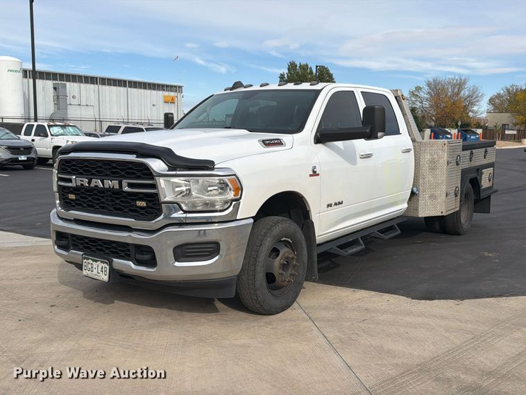 image for item EW1194 2020 RAM 3500 Crew Cab flatbed pickup truck
