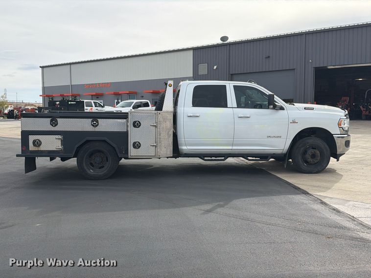 image for item EW1194 2020 RAM 3500 Crew Cab flatbed pickup truck