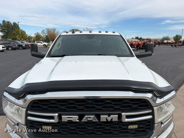 image for item EW1194 2020 RAM 3500 Crew Cab flatbed pickup truck