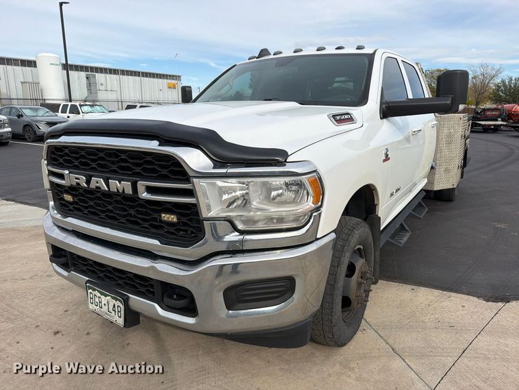 image for item EW1194 2020 RAM 3500 Crew Cab flatbed pickup truck