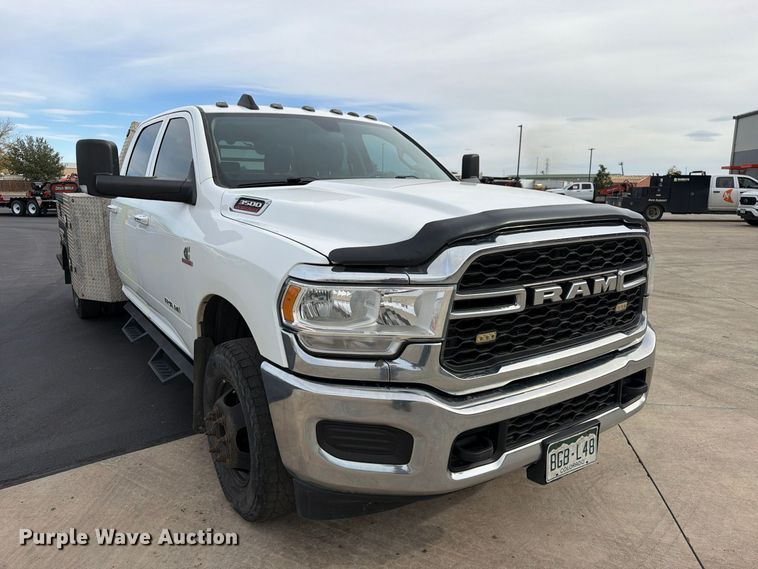 image for item EW1194 2020 RAM 3500 Crew Cab flatbed pickup truck