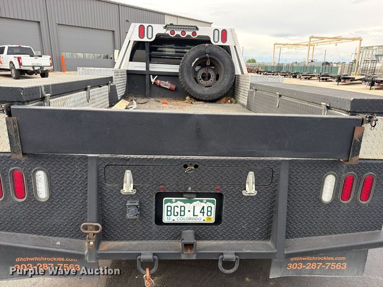 image for item EW1194 2020 RAM 3500 Crew Cab flatbed pickup truck