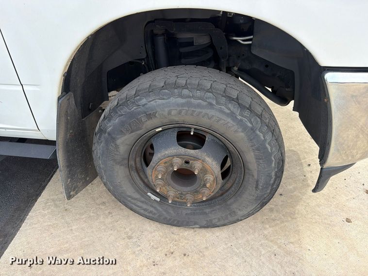 image for item EW1194 2020 RAM 3500 Crew Cab flatbed pickup truck